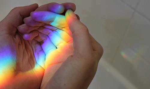 hands with rainbow